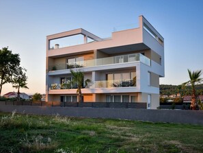 A modern multi-story building with balconies and large windows. - Apartment  by Interhome (Zadar/Bibinje)