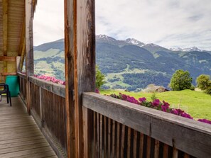 A wooden deck with a view of a mountainous landscape. - Bauernhof Cathomas, Brigels, (Breil/Brigels), 65008B by Interhome (Breil/Brigels)