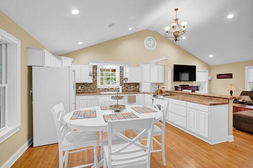 Lakefront Retreat with private dock, game room, bar, and sunroom views