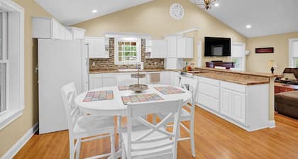 Lakefront Retreat with private dock, game room, bar, and sunroom views