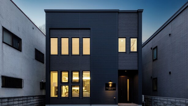 A modern building with a flat roof, large windows, and a sign reading 'The Polaris.' - THE POLARIS (Sapporo)
