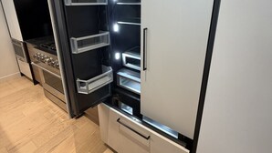 A modern kitchen with a built-in refrigerator, oven, and microwave. - 2Bed 2.5Bath Pet Friendly Townhouse Downtown Halifax (Halifax)