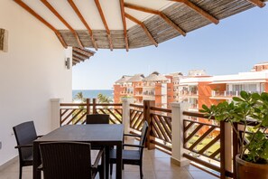Outdoor dining - Beautiful top floor Two Bedroom Oceanview (Bajos de Chila)