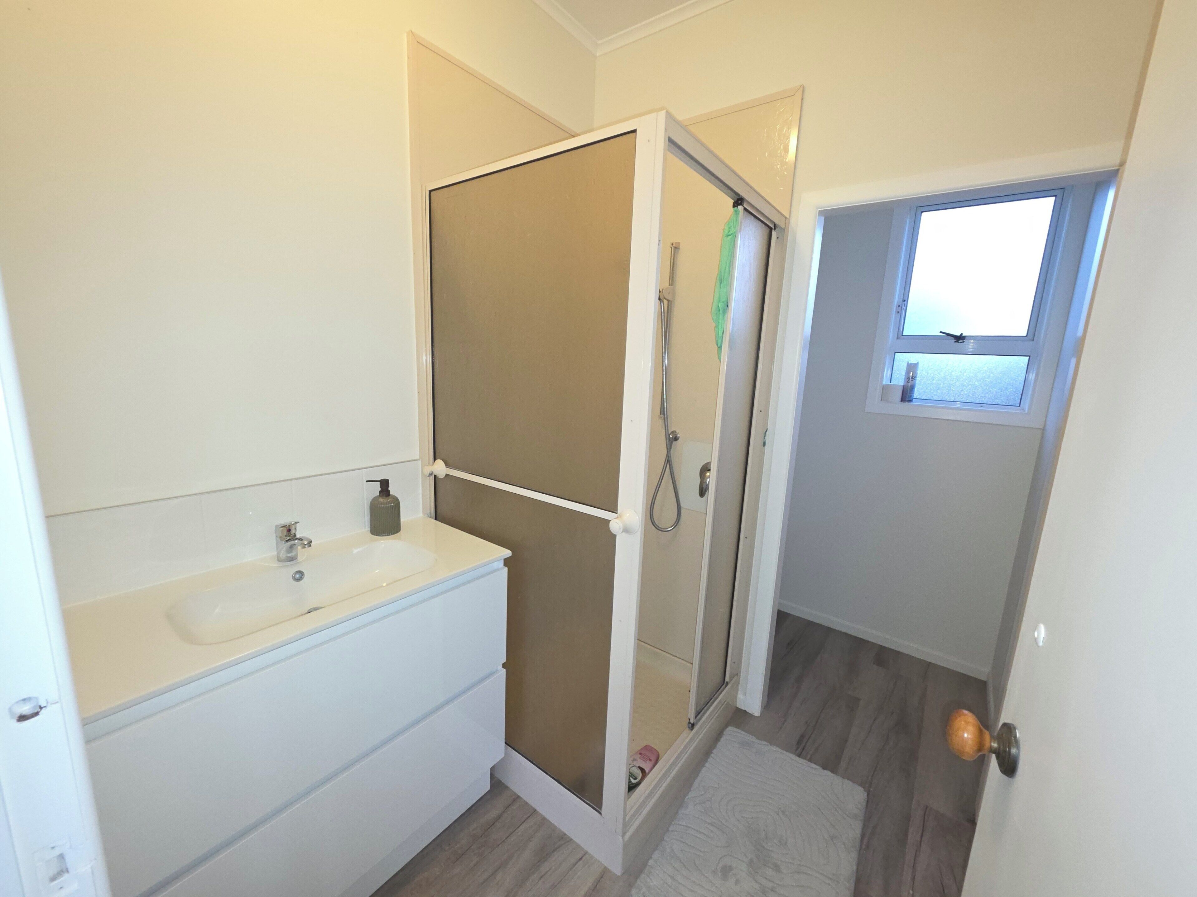 Shower, towels, soap, toilet paper