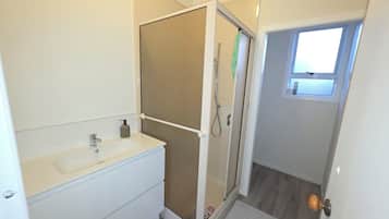 Shower, towels, soap, toilet paper
