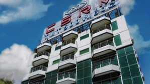 A multi-story building with a prominent sign for 'HINEMOON RESORTS & RESTAURANT' at the ground level. - Honeymoon Resorts Cox's Bazar (Cox's Bazar)