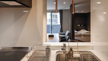 Apartment | Private kitchen | Mini-fridge, microwave, stovetop, cookware/dishes/utensils