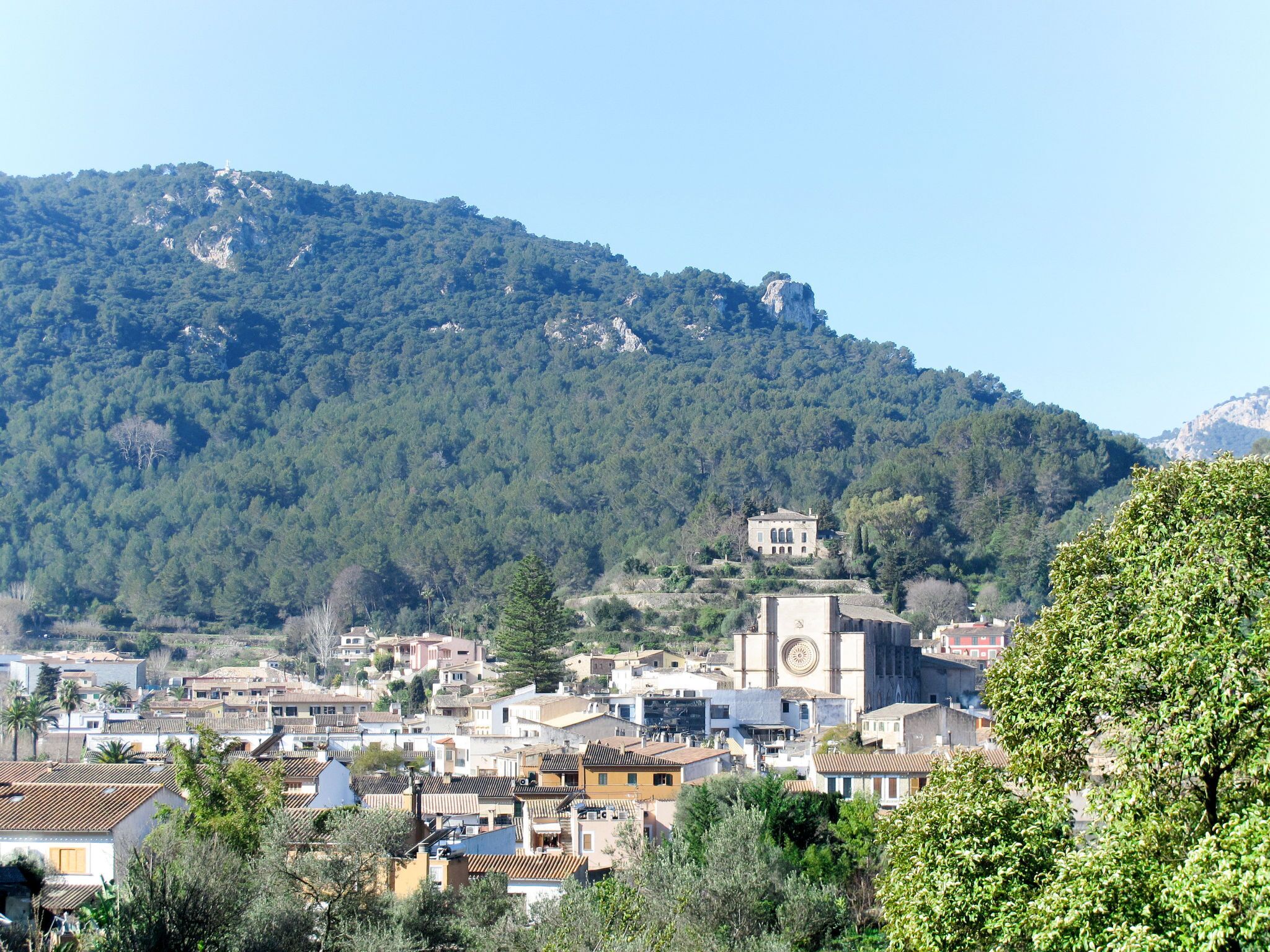 A town with buildings and a church with a clock tower.