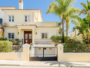 A two-story house with a tiled roof, a front door, and a gated entrance. - Endless Summer Luxury Villa by Interhome (Almancil)