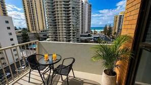Outdoor dining - Beachside 1BR Retreat | Ocean Views, Wi-Fi & Pool (Surfers Paradise)