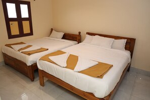 Quadruple Room | Egyptian cotton sheets, premium bedding, desk, free WiFi - RKS Residency (Tiruvannamalai)