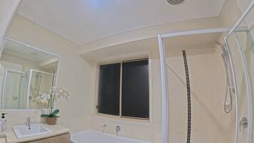 Shower, towels, soap, toilet paper