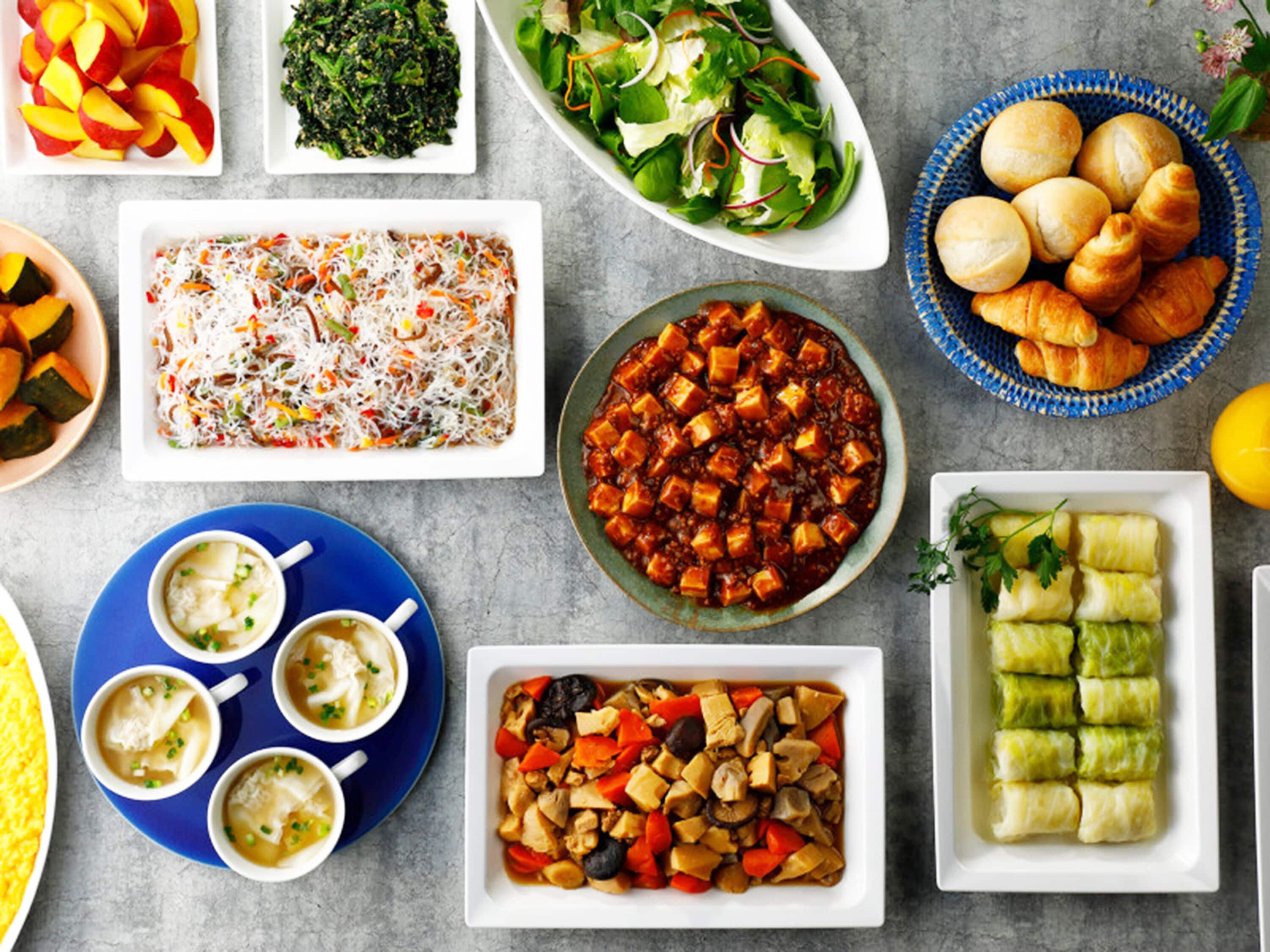 A variety of dishes including a salad, soup, and a casserole.