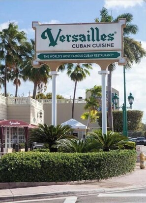 A sign for Versailles Cuban Cuisine restaurant. - Miami Enchanted Studio (Miami Gardens)