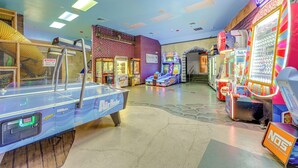 An indoor arcade with various gaming machines, including a pool table and a racing game. - Pet-Friendly Townhome 9 Mi to Disney w/ Lazy River (Davenport)