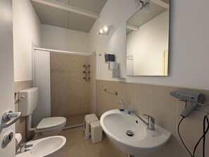 A bathroom with a toilet, bidet, sink, and a shower area. - Villa in Marina Di Ragusa with 3 bedrooms sleeps 7 (Marina Di Ragusa)