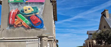 A building with a large advertisement for a travel kit.
