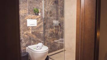 Shower, hair dryer, slippers, towels