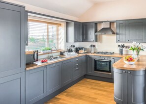Fridge, oven, stovetop, toaster - 2 bedroom accommodation in Isle Of Anglesey (Isle Of Anglesey)