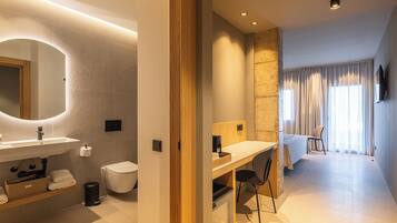 Premium Apartment, Garden View | Bathroom | Shower, hair dryer, towels, soap