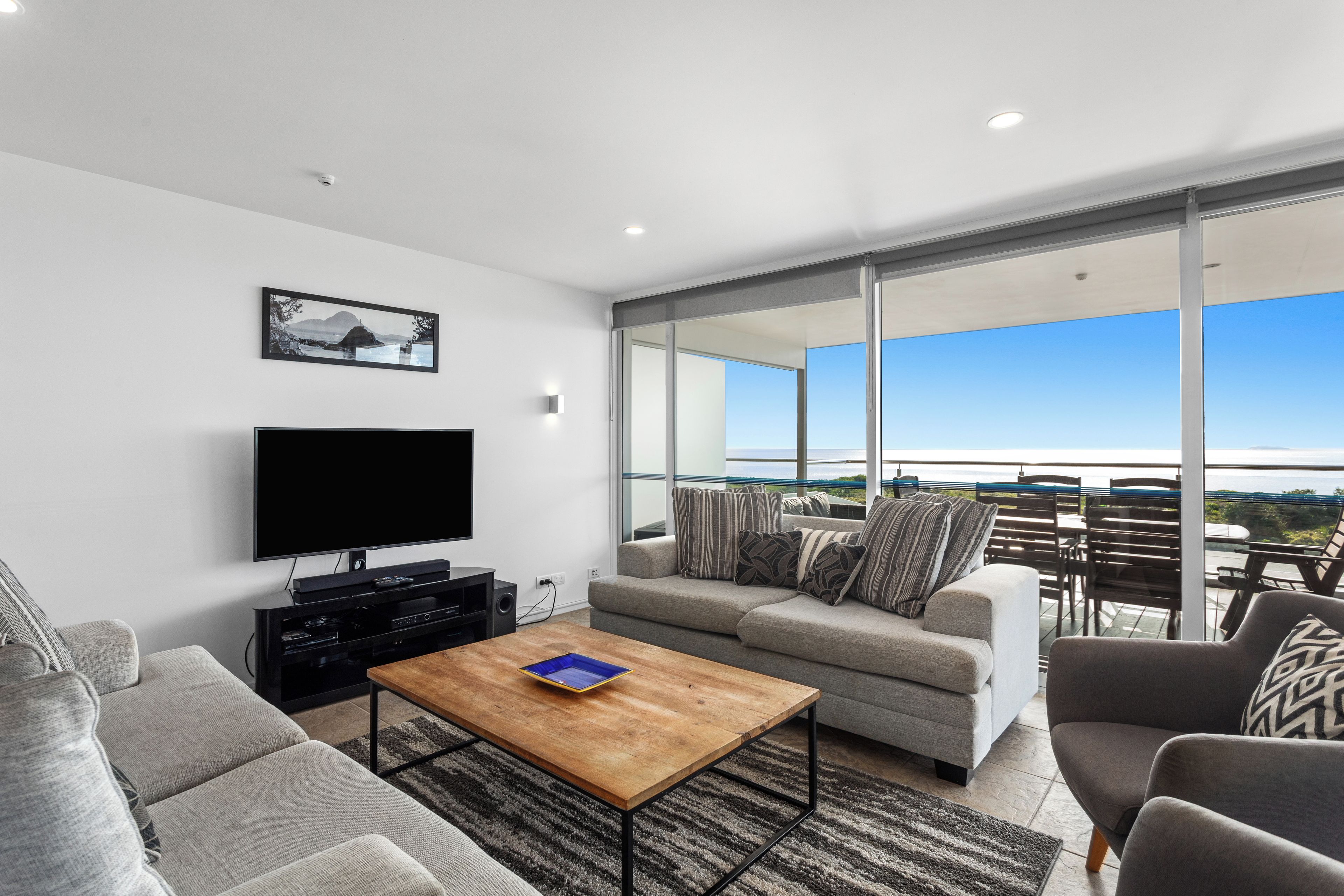 Deluxe Penthouse, Balcony, Ocean View | Living area | Table tennis, books