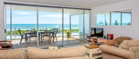 Penthouse Deluxe, balcón, vista al océano | Área de sala de estar