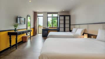 Deluxe Triple Room, City View | In-room safe, desk, laptop workspace, soundproofing