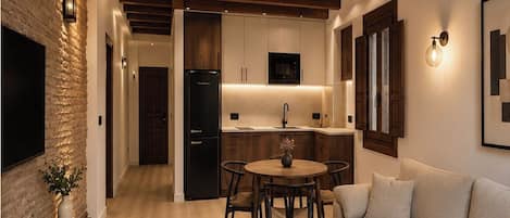 Apartamento estándar | Zona de estar | Una televisión de pantalla plana