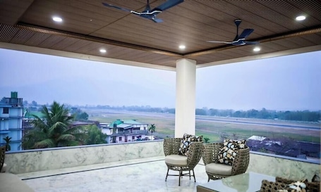 Deluxe Room, City View | Terrace/patio. Hotel Airport View
