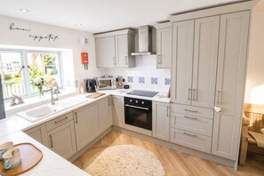 Fridge, microwave, oven, cookware/dishes/utensils