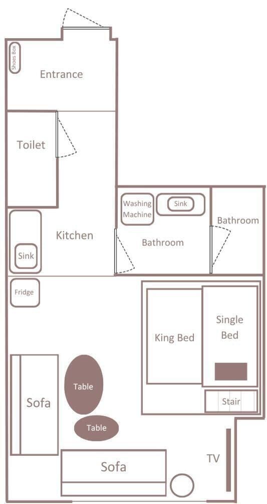 A hotel room layout with an entrance, two bathrooms, a kitchen, a king bed, a single bed, a sofa, a TV, and two tables.
