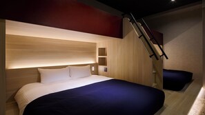 A modern bedroom with a bed, built-in shelving, and a staircase. - Minn Namba South (Osaka)