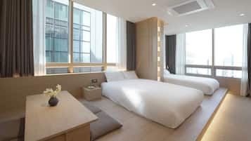 Suite Premier, vista città | Tende oscuranti, ferro/asse da stiro, Wi-Fi gratuito, lenzuola