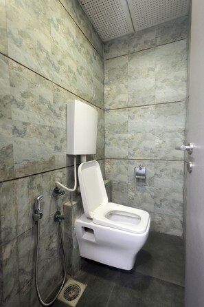 Superior Room | Bathroom | Shower, soap, shampoo, toilet paper - Palm Greens Suites & Banquet (Surat)