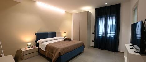 In-room safe, desk, laptop workspace, blackout curtains