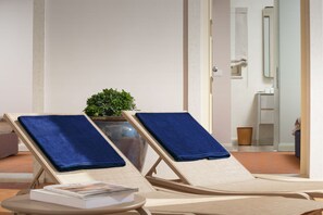 Two lounge chairs with blue towels, a small table with a book, and a potted plant. - Villa Bianca - Casa del Sole (Tar-Vabriga)
