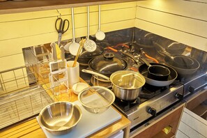 A kitchen with a stove, pots, pans, and various utensils. - Kaneko sanso KK1 (Hokuto city Oizumi cho Nishiide)