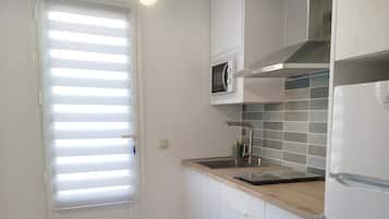 Fridge, microwave, stovetop, coffee/tea maker