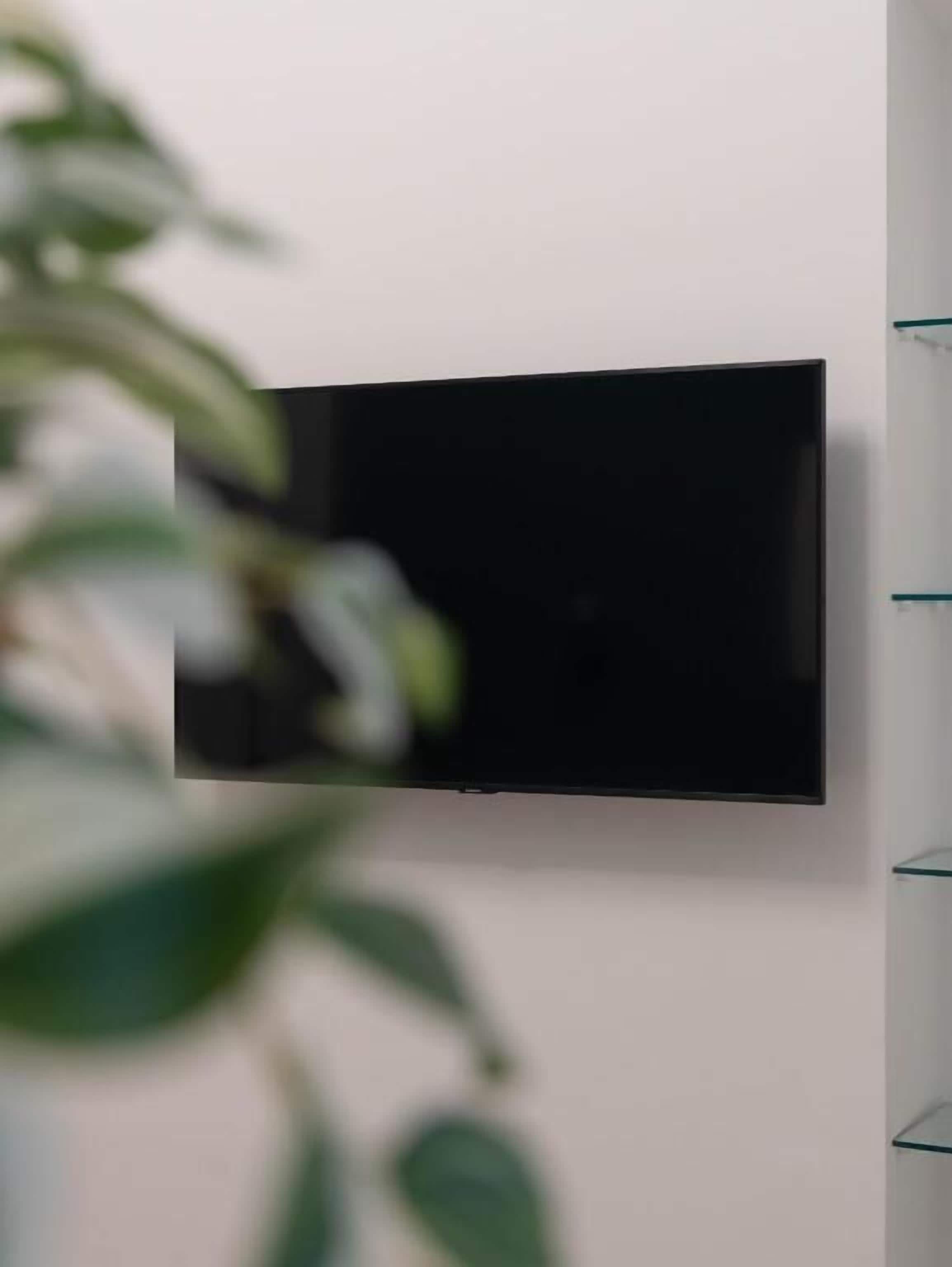 A flat-screen TV mounted on a wall.