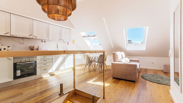 A modern apartment with a kitchen, dining area, and a living room with a view. - White Angels by Portas do Sol Apartments (Lisbon)