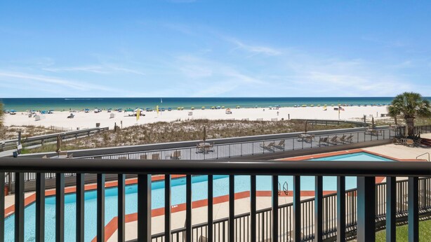 A pool with a view of the beach and ocean. - Romar House 203A by Liquid Life (Orange Beach)