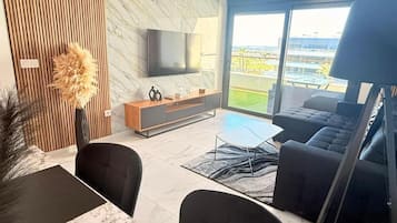Apartment, Balcony, Garden View | Living area | TV