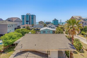 A residential area with houses, a swimming pool, and a clear sky. - Walk to Beach! North Myrtle Beach Condo w/ Balcony (North Myrtle Beach)