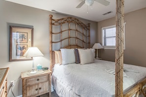A bedroom with a bed, bedside tables, a lamp, a ceiling fan, and a window with blinds. - Walk to Beach! North Myrtle Beach Condo w/ Balcony (North Myrtle Beach)