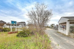 A private property with a beach club sign, a large tree, and residential houses. - Walk to Beach & Pool! East End P-town Condo (Provincetown)