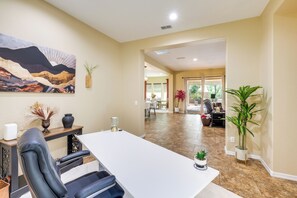 A spacious dining area with a long table, chairs, and a painting on the wall. - Tranquil Home w/ Hot Tub in 55+ Florence Community (Florence)