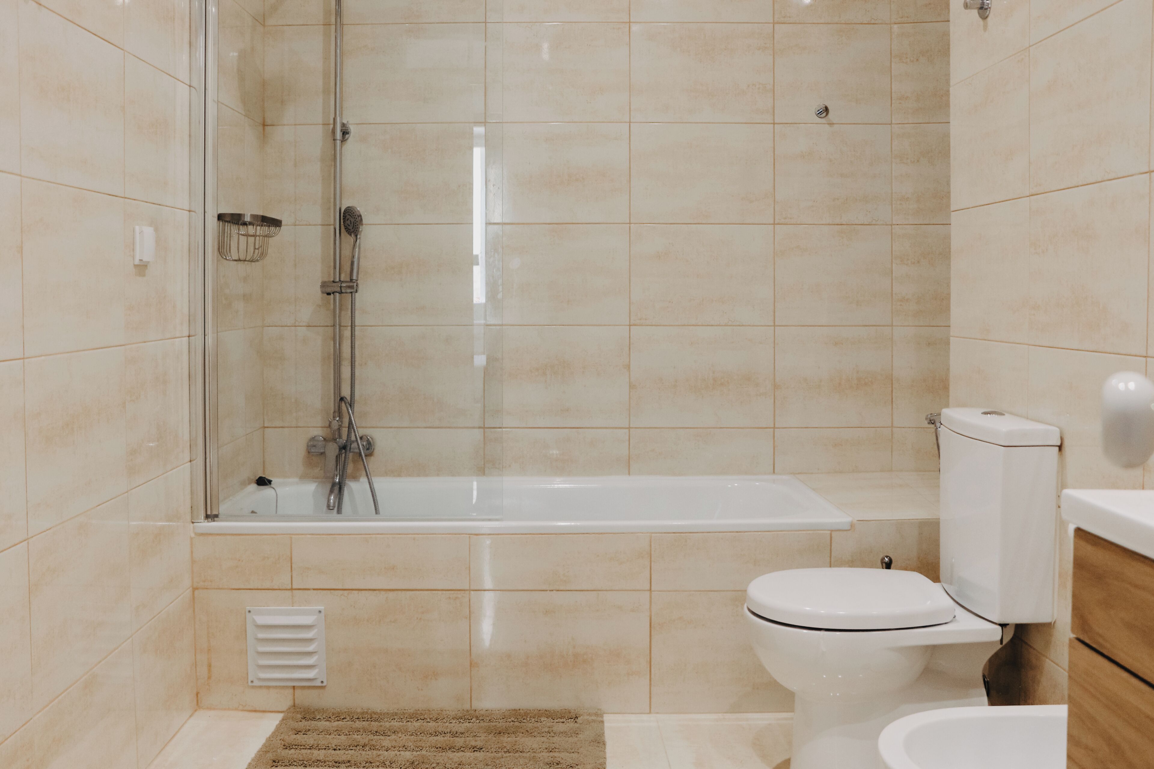 Bathtub, hair dryer, towels, soap