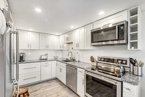 Fridge, microwave, oven, stovetop - Renovated Rehoboth Beach condo with ocean-view balcony - walk to beach (Rehoboth Beach)
