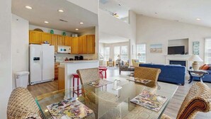 A modern apartment with a kitchen, dining area, and living room. - Bear Trap Dunes 2nd floor condo w/ tennis court, basketball court, & golf (Ocean View)