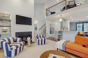 TV, fireplace - Grande at Canal Pointe home with pools, sports courts, & gym (Rehoboth Beach)